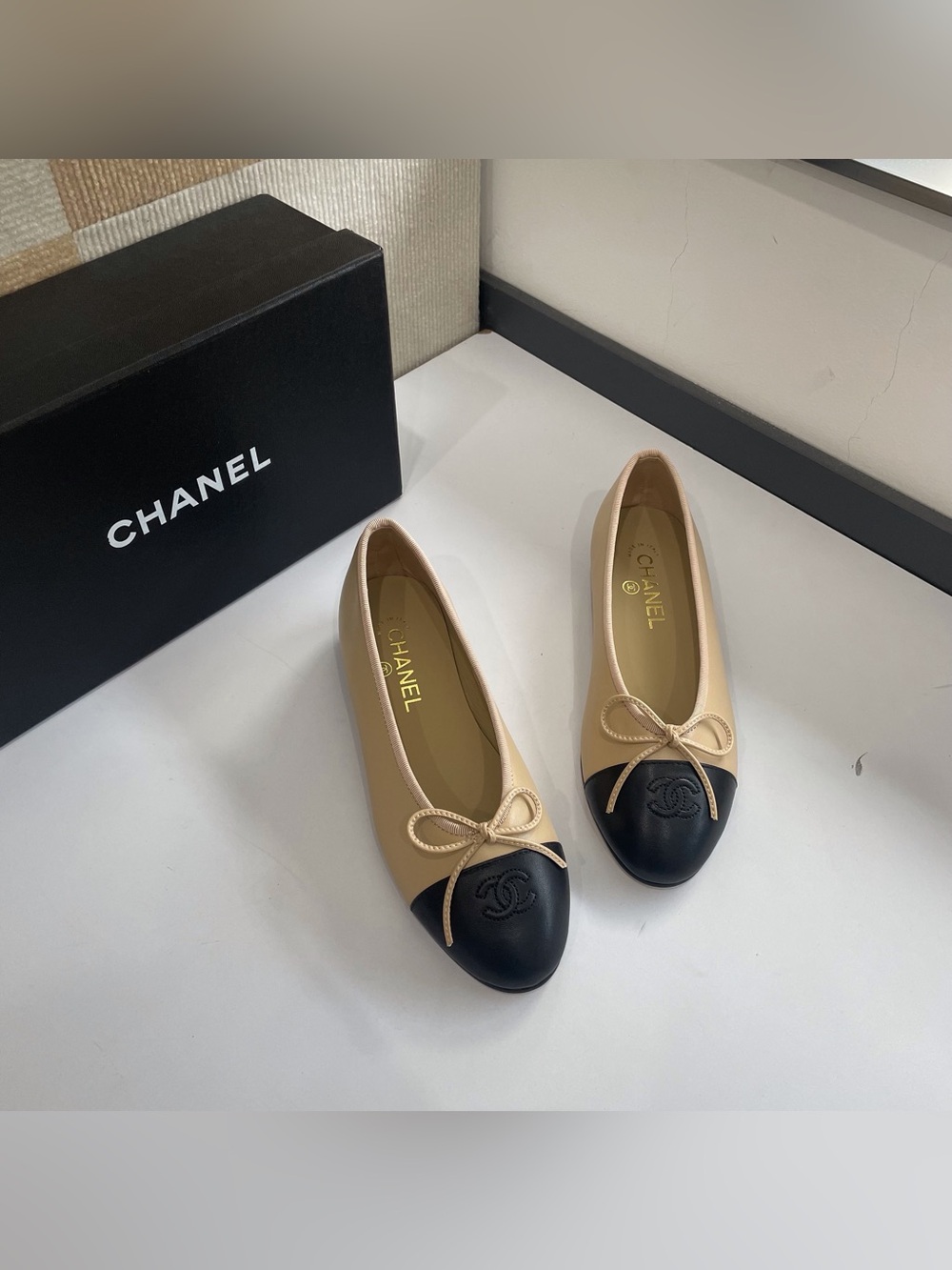 CHANEL Cream and Black Two-Tone Cap-Toe Ballet Flats